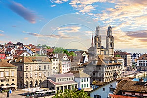 Sunset view on the downtown of Zurich by Grossm nster Romanesque Protestant church, Switzerland