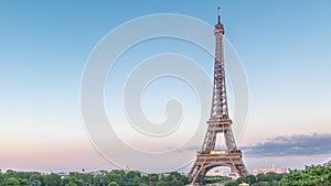 Sunset view of Eiffel Tower timelapse with fountain in Jardins du Trocadero in Paris, France.