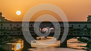 Sunset view of Florence Ponte Vecchio over Arno River in Florence timelapse, Italy.