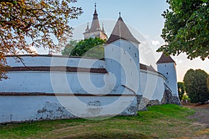 Sunset view of the Fortified Evangelical Church in Harman, Roman