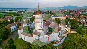 Sunset view of the Fortified Evangelical Church in Harman, Roman