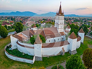 Sunset view of the Fortified Evangelical Church in Harman, Roman