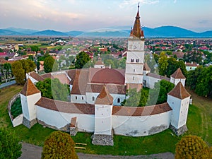 Sunset view of the Fortified Evangelical Church in Harman, Roman