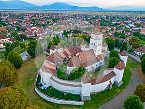 Sunset view of the Fortified Evangelical Church in Harman, Roman