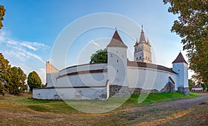 Sunset view of the Fortified Evangelical Church in Harman, Roman