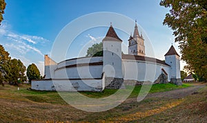 Sunset view of the Fortified Evangelical Church in Harman, Roman