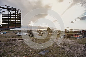 Sunset view on graveyard of old and rusty cars photo