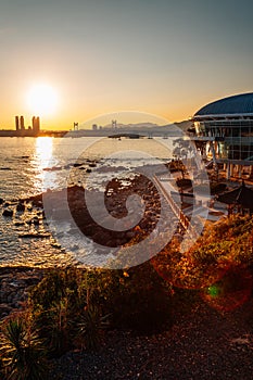 Sunset view of Gwangan bridge and sea at Haeundae Dongbaekseom island in Busan, Korea