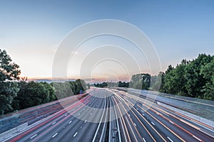 Sunset view heavy traffic moving at speed on UK motorway in England