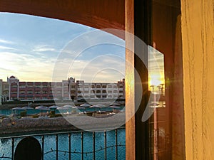 Sunset view from the hotels balcony window reflection