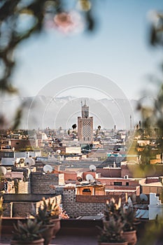 Sunset view of Koutoubia mosque in Marrakesh, Morocco with stork silhouette. Panoramic view of Marrakech with the old
