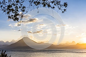 Sunset view of Lake Atitlan & volcano, Guatemala, Central America