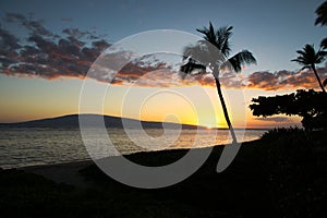 Sunset view of Lanai from Baby Beach on the island of Maui.