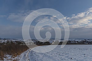 Sunset view near Celoznice village and Kyjov town in winter cold evening