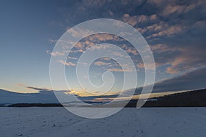 Sunset view near Celoznice village and Kyjov town in winter cold evening