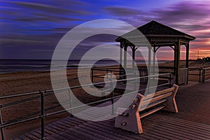 Sunset view of a ocean shore and gazebo