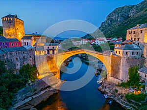 Sunset view of the old Mostar bridge in Bosnia and Herzegovina photo