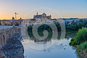 Sunset view of the old roman bridge in the spanish city cordoba