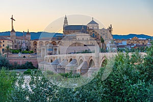 Sunset view of the old roman bridge in the spanish city cordoba