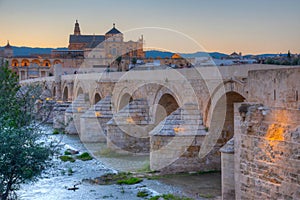 Sunset view of the old roman bridge in the spanish city cordoba