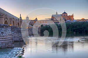 Sunset view of the old roman bridge in the spanish city cordoba