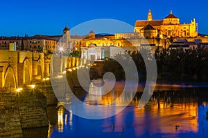 Sunset view of the old roman bridge in the spanish city cordoba