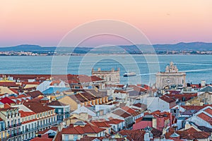 Sunset view of the old town and praca do Commercio in Lisbon, Portugal photo