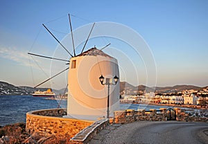 Sunset view of old windmill and Paros old town