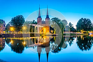 Sunset view of Oostpoort gate leading to the Dutch city Delft, Netherlands