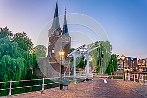 Sunset view of Oostpoort gate leading to the Dutch city Delft, Netherlands