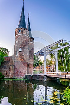 Sunset view of Oostpoort gate leading to the Dutch city Delft, Netherlands