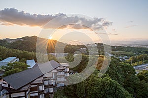 Sunset view over the Arima Onsen city with mountains and traditional Japanese buildings photo