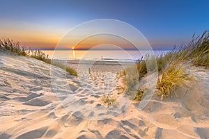 Sunset View over ocean from dune in Zeeland photo