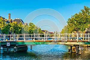 Sunset view over a pedestrian bridge over a canal in Leiden, Netherlands