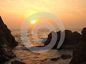 Sunset view over sea with stones