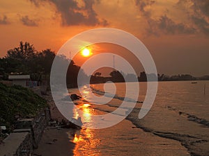 Sunset view over sea with stones
