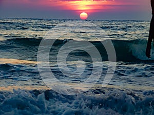 Sunset view over sea waves
