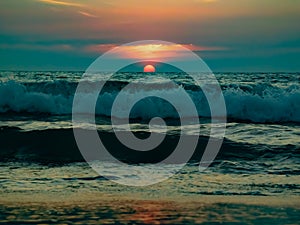 Sunset view over sea waves
