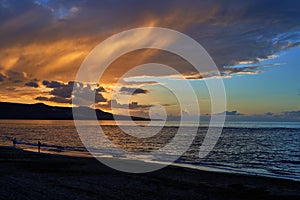 Sunset view at Playa de Las Canteras beach at Las Palmas de Gran Canaria, Spain