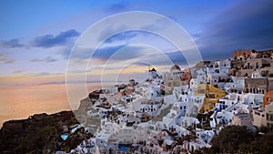 The sunset view point of the landmark view in Oia, Santorini. Image of famous village Oia located at one of Cyclades island of