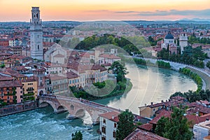 Sunset view of Ponte Pietra bridge in Verona, Italy