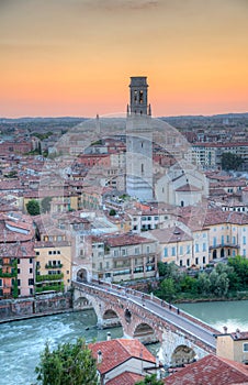 Sunset view of Ponte Pietra bridge in Verona, Italy