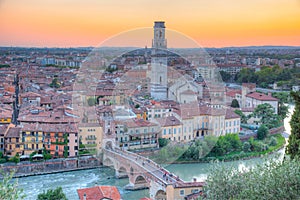 Sunset view of Ponte Pietra bridge in Verona, Italy