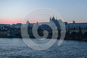 Sunset view of River Vltava, Charles Bridge and Prague Castle in Czech Republic