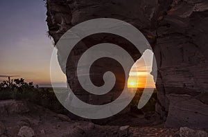 Sunset view through the rock. Arenite hole, in Jalapao, Brazil. Pedra furada.