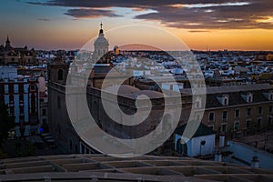 A sunset view of the rooftops of Seville taken from the Metropol Parasol, looking out towards the main catherdral.