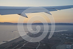 Sunset view of sky from a window seat in an airplane