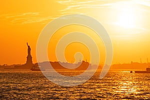 Sunset view of Statue of Liberty in New York City, USA