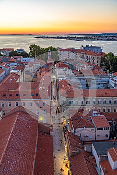 Sunset view of a street leading to Gospe od Zdravlja church in Zadar, Croatia