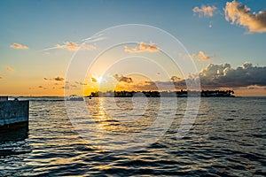 Sunset, view of Sunset y Island from Mallory Square, Key West, Florida, US